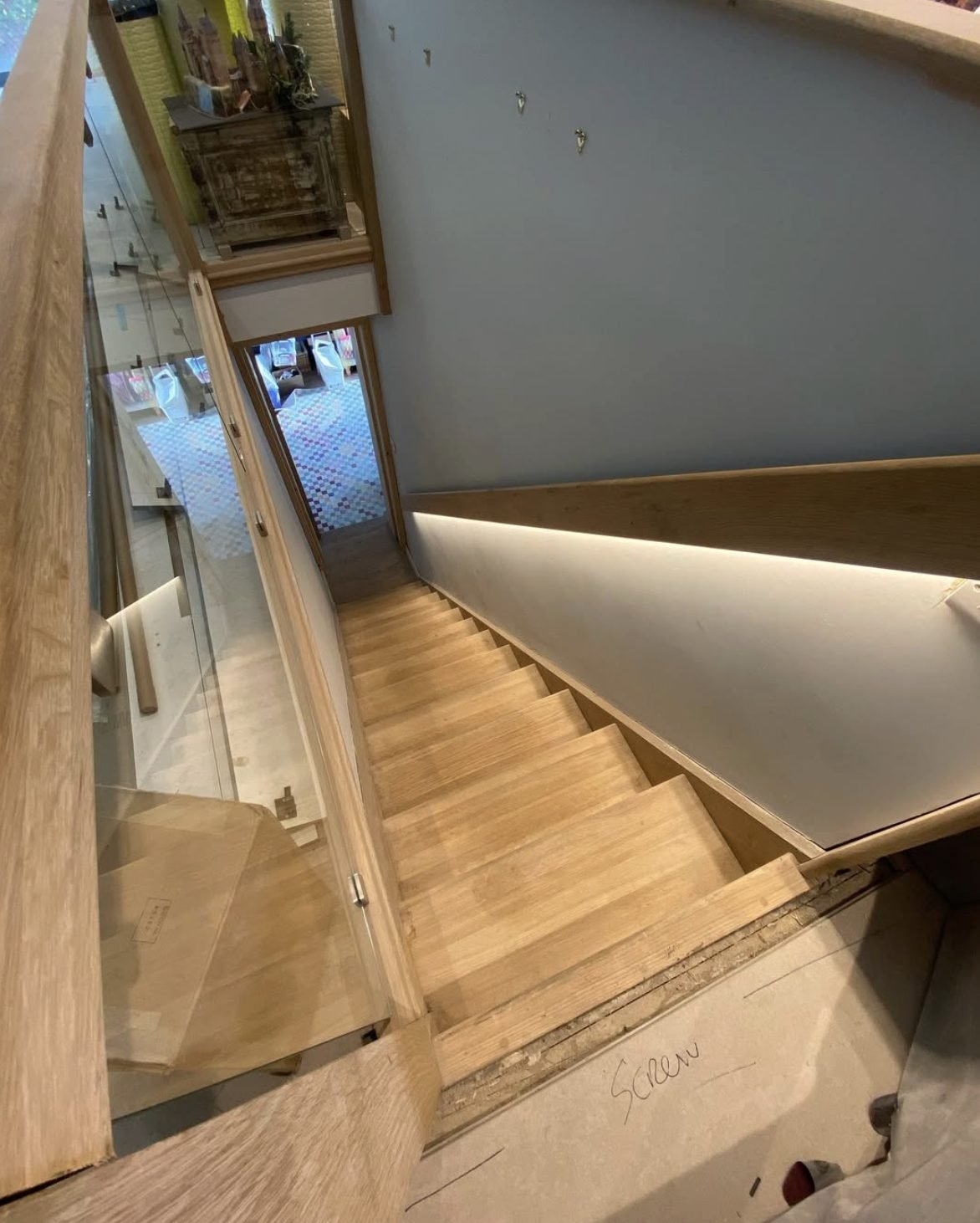 LED strip lighting on oak staircase